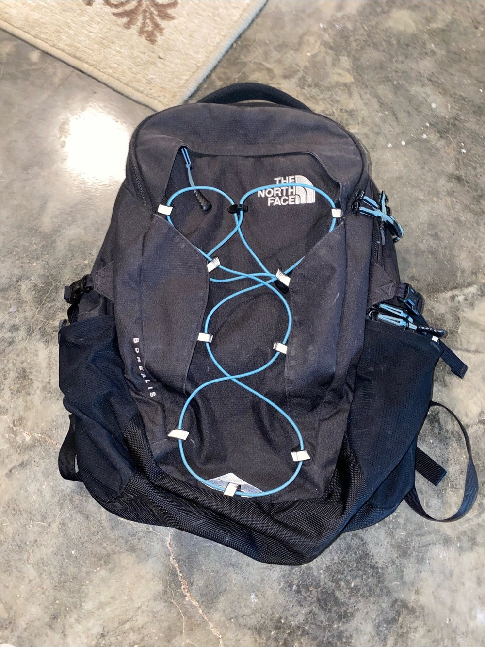 The North Face Black Backpack with Blue Cord Detailing